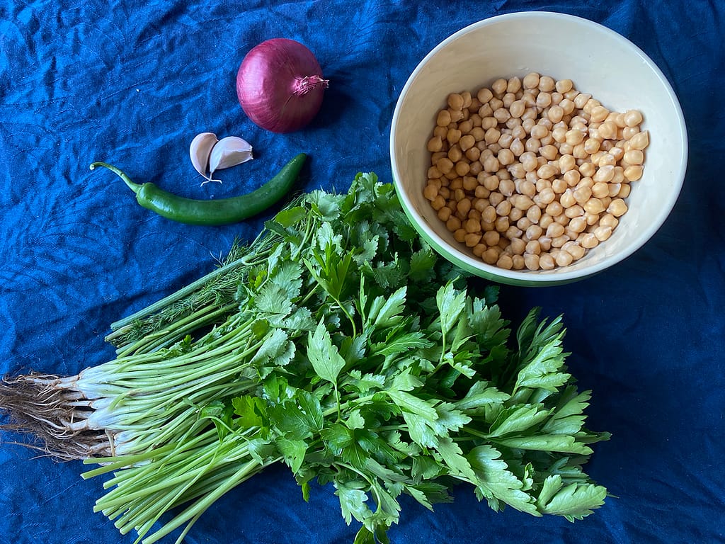 healthy baked falafel ingredients - dill, parsley, coriander, chilli, garlic, onion and chickpeas