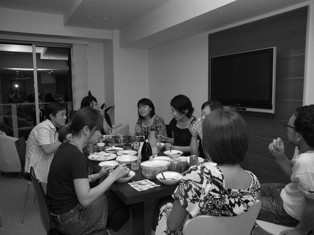 finding a health community can make motivation bigger than oneself - a group of people sitting at a table eating dinner