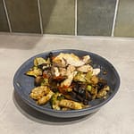plate with baked veggies and sliced chicken breast in my new kitchen