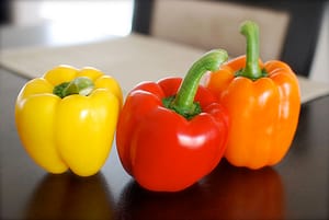 yellow red and orange capsicum (bell peppers)