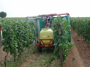 pesticide spraying in crops tractor spraying vines with pesticides