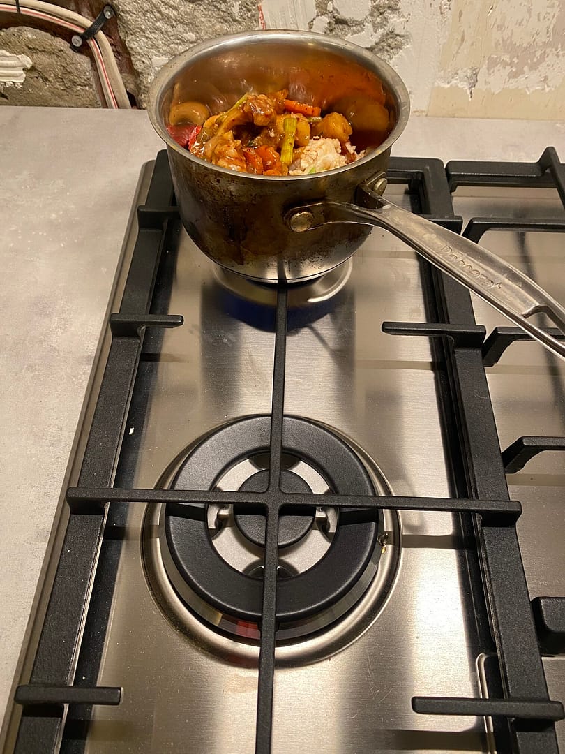 noi thai on the gas hob in a saucepan